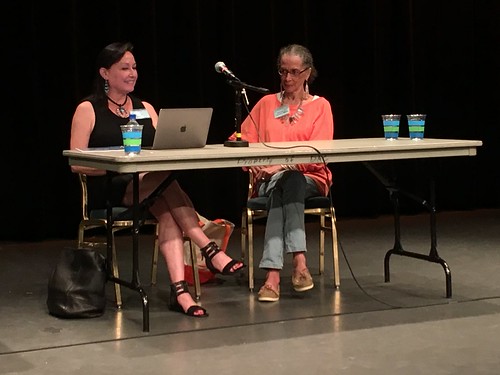 Neeta Lind aka navajo and Denise Oliver-Velez sitting on a panel regarding Coalition Building