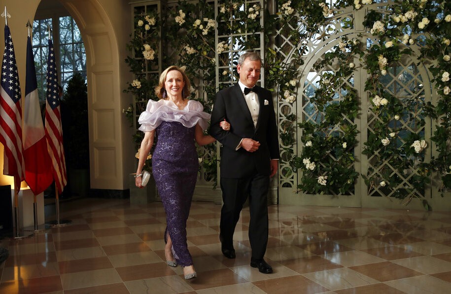 Supreme Court Justice Chief Justice John Roberts and his wife Jane Roberts arrive for a State Dinner with French President Emmanuel Macron and President Donald Trump at the White House, Tuesday, April 24, 2018, in Washington. (AP Photo/Alex Brandon)