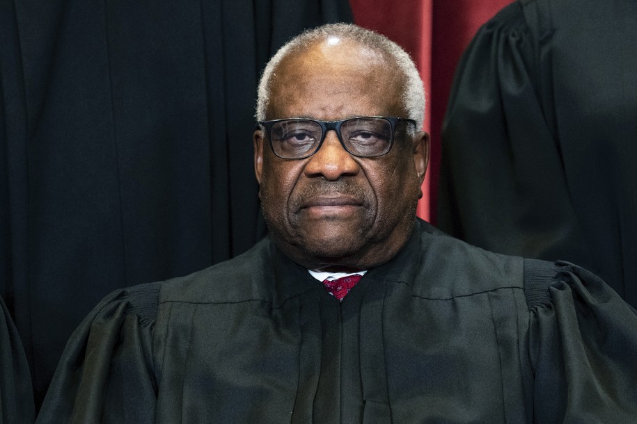 FILE - Justice Clarence Thomas sits during a group photo at the Supreme Court in Washington, on Friday, April 23, 2021. Thomas has been hospitalized because of an infection, the Supreme Court said Sunday, March 20, 2022. Thomas, 73, has been at Sibley Memorial Hospital in Washington, D.C., since Friday, March 18 after experiencing â€œflu-like symptoms,â€ the court said in a statement. (Erin Schaff/The New York Times via AP, Pool, File)