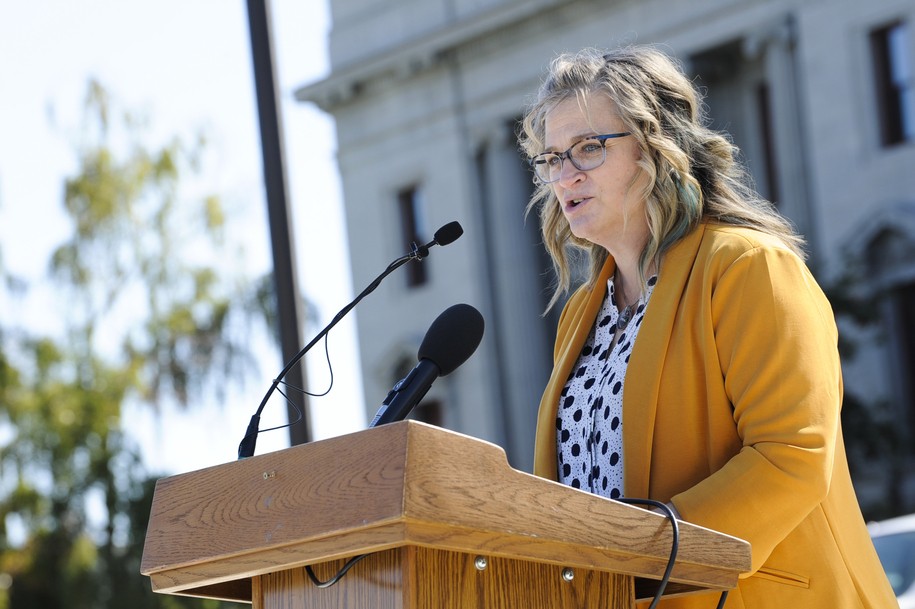 Jenna Banna, a mother from Missoula, Mont., speaks during a rally at the Montana Capitol in Helena, Mont., Wednesday, Sept. 21, 2022. Banna spoke in opposition to a proposed referendum that requires that all infants born alive, including during an attempted abortion, be provided with medical care and treatment. She spoke about her daughter, who was born without a properly developed brain, and said the referendum requiring treatment could have robbed her and her husband with the brief time they got to spend with their daughter before she died. (Thom Bridge/Independent Record via AP)