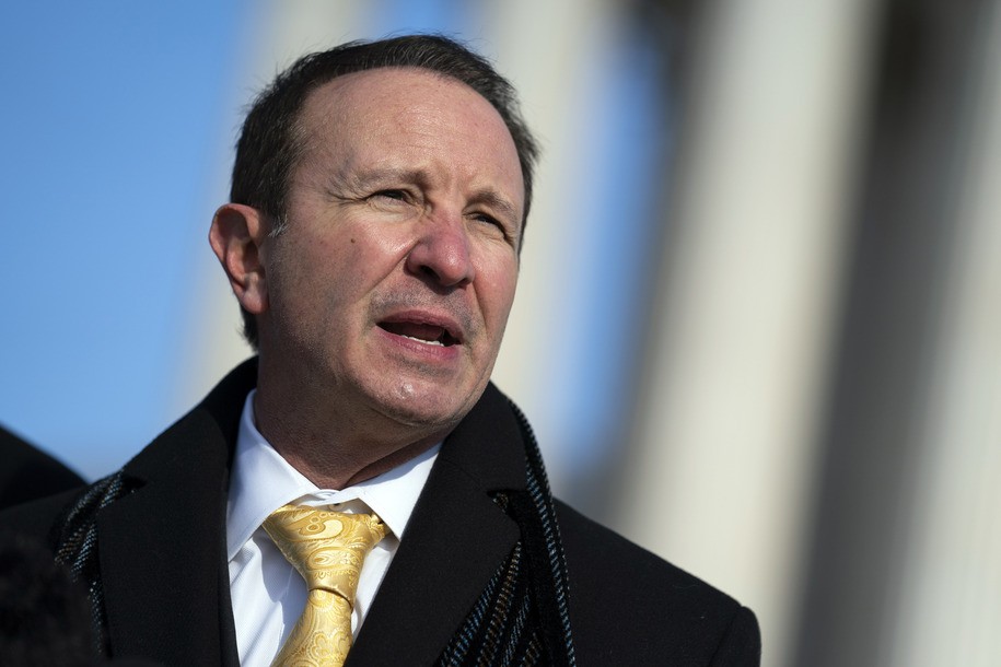 FILE - Louisiana Attorney General Jeff Landry talks to reporters outside the Supreme Court, Jan. 7, 2022, in Washington. Activists in Louisiana are voicing concerns over a bill advancing in the GOP-controlled House to bar children and teens from accessing public library books deemed “sexually explicit,” saying the proposal could be used to target LGBTQ+ content. They also warned of efforts by Republican Attorney General Landry, who is also a gubernatorial candidate, to investigate such explicit material. (AP Photo/Evan Vucci, File)