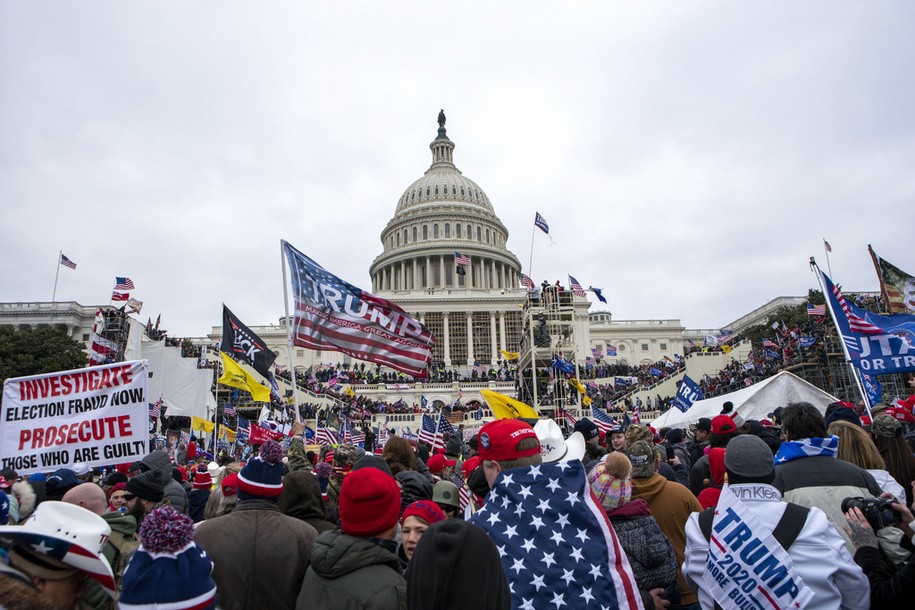 FILE - Insurrections loyal to President Donald Trump rally at the U.S. Capitol in Washington on Jan. 6, 2021. Ray Epps, an Arizona man who became the center of a conspiracy theory about Jan. 6, 2021, has been charged with a misdemeanor offense in connection with the U.S. Capitol riot, according to court papers filed Tuesday.  Epps is charged with a single count of a disorderly or disruptive conduct on restricted grounds. 