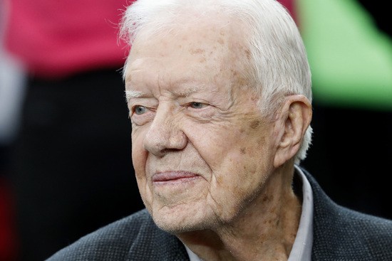 FILE - Former President Jimmy Carter sits on the Atlanta Falcons bench before the first half of an NFL football game between the Atlanta Falcons and the San Diego Chargers, Oct. 23, 2016, in Atlanta. Former President Carter, on Saturday Sept. 23 2023 made a surprise appearance at the Plains Peanut Festival in their Georgia hometown, the Carter Center wrote in a social media post on X, formerly known as Twitter.