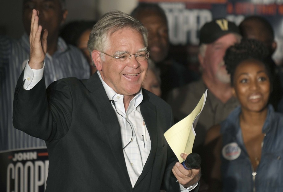 Nashville mayoral candidate John Cooper interacts with supporters during an election night party in Nashville, Tenn., on Thursday, Aug. 1, 2019. The Metro Councilman and Mayor David Briley are headed into a runoff in the mayor's race. (Shelley Mays/The Tennessean via AP)