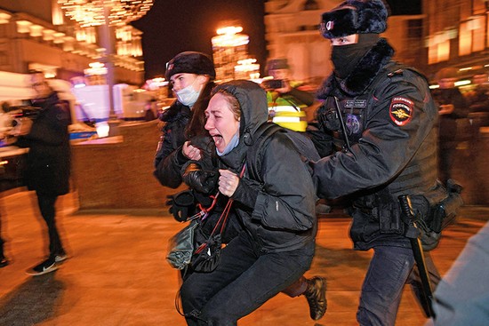 TOPSHOT - Police officers detain a demonstrator during a protest against Russia's invasion of Ukraine in Moscow on February 24, 2022. - Russian President Vladimir Putin launched a full-scale invasion of Ukraine on Thursday, killing dozens and triggering warnings from Western leaders of unprecedented sanctions. Russian air strikes hit military installations across the country and ground forces moved in from the north, south and east, forcing many Ukrainians flee their homes to the sounds of bombing. (Photo by Alexander NEMENOV / AFP) (Photo by ALEXANDER NEMENOV/AFP via Getty Images)