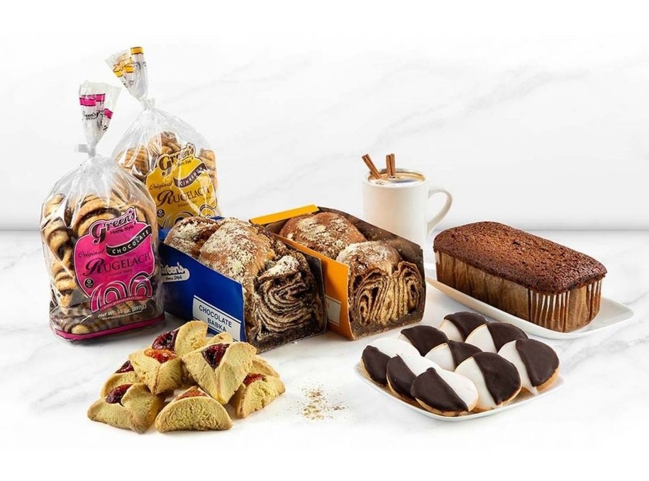 A gift bundle from Green's Bakery showing cakes and cookies.