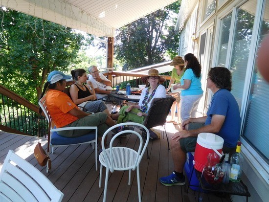 State Senator Dr. Irene Aguilar (in orange) chatting with Kossacks and neighbors.  Jenn (next to Senator Aguilar) and Leftcandid (on the right in blue shirt) started the Caffeinating Liberally group.