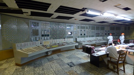 The Unit 2 control room, Chernobyl Nuclear Power Plant, in 2013.  At left is "A" Desk, where the reactor is controlled.  The center "P" Desk operates the balance-of-plant (pumps, feedwater, etc.).  On the far right is "T" Desk, where the turbines and generators are controlled.