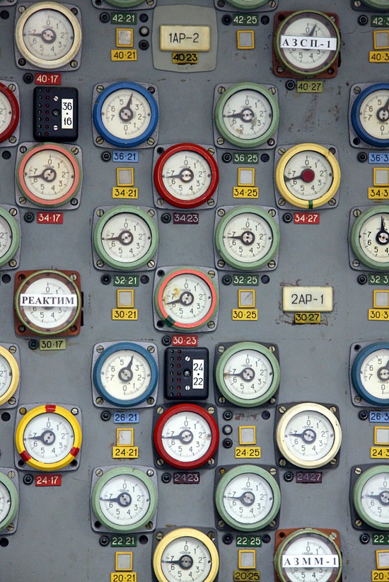 Servo indicators for control rods in the Unit 1 control room of Chernobyl Nuclear Power Plant.  Rods are grouped into several color-coded divisions.  Most enter from the top of the core, but one group (blue bezels) enter from the bottom.