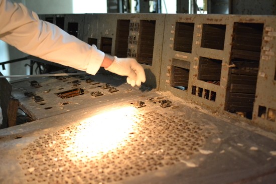 My hand reaches toward the location of the AZ-5 switch (now missing) on the reactor control desk of Unit 4, Chernobyl Nuclear Power Plant.