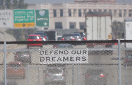 Defend Our Dreamers sign over Hwy 110