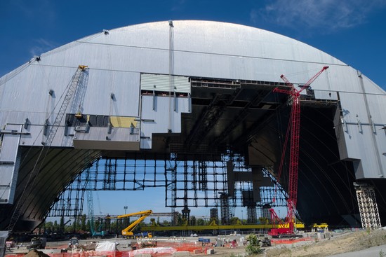 The New Safe Confinement arch rises, as seen from the Unit 4 side of Chernobyl Nuclear Power Plant in 2015.