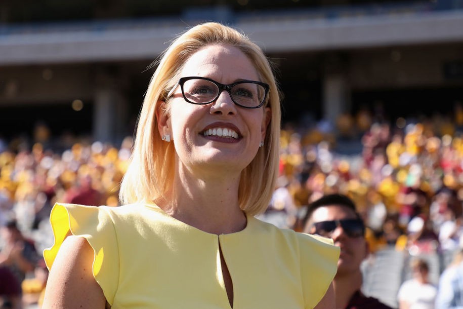 TEMPE, AZ - NOVEMBER 03:  Democrat U.S. Senate candidate Kyrsten Sinema participates in the pregame coin toss before the game between the Utah Utes and the Arizona State Sun Devils at Sun Devil Stadium on November 3, 2018 in Tempe, Arizona. Sinema is running against two-term congresswoman Martha McSally. (Photo by Christian Petersen/Getty Images)