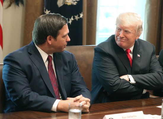 WASHINGTON, DC - DECEMBER 13:  Florida Governor-elect Ron DeSantis (R) sits next to U.S. President Donald Trump during a meeting with Governors elects in the Cabinet Room at the White House on December 13, 2018 in Washington, DC.  (Photo by Mark Wilson/Getty Images)