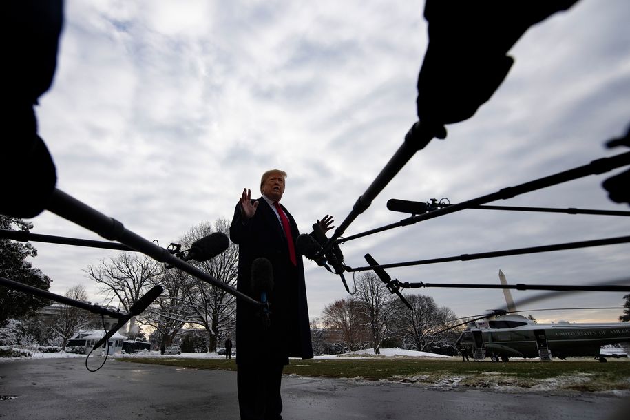 US President Donald Trump speaks to the media as he departs the White House in Washington, DC, on January 14, 2019 en route to New Orleans, Louisiana to address the annual American Farm Bureau Federation convention. - US President Donald Trump said Monday he has 'never worked for Russia,' assailing reports that raised questions about his ties to Vladimir Putin as a 'big fat hoax.'Trump's comments to reporters at the White House followed a Washington Post report over the weekend that said the president has kept his top aides in the dark about his private conversations with the Russian leader. (Photo by Jim WATSON / AFP) (Photo by JIM WATSON/AFP via Getty Images)