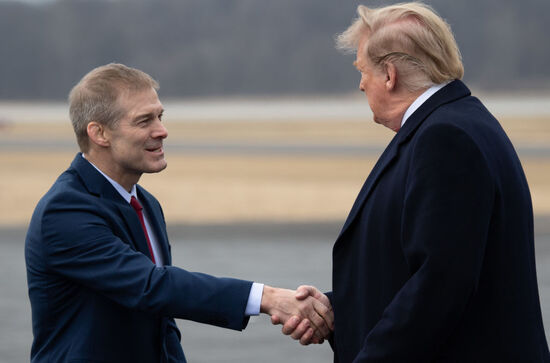 US President Donald Trump shakes hands with US Representative Jim Jordan, Republican of Ohio, as he disembarks from Air Force One upon arrival at Lima Allen County Airport in Lima, Ohio, March 20, 2019, as he travels to visit a military manufacturing facility and attend a fundraiser. 