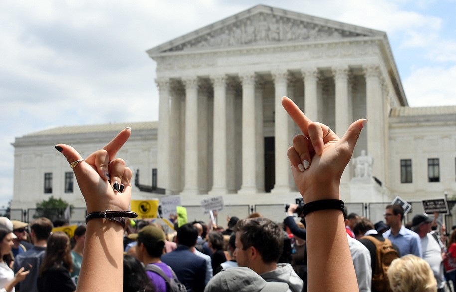 Abortion rights activists react outside the US Supreme Court in Washington, DC, on June 24, 2022. - The US Supreme Court on Friday ended the right to abortion in a seismic ruling that shreds half a century of constitutional protections on one of the most divisive and bitterly fought issues in American political life. The conservative-dominated court overturned the landmark 1973 