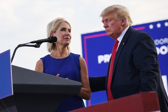 MENDON, IL - JUNE 25: U.S. Representative Mary Miller (R-IL) is welcomed to the stage by Donald Trump after receiving an endorsement during a Save America Rally with former US President Donald Trump at the Adams County Fairgrounds on June 25, 2022 in Mendon, Illinois. Trump will be stumping for Rep. Mary Miller in an Illinois congressional primary and it will be Trump's first rally since the United States Supreme Court struck down Roe v. Wade on Friday. (Photo by Michael B. Thomas/Getty Images)