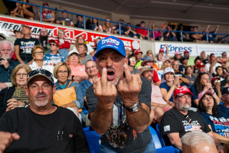 WILKES-BARRE, PENNSYLVANIA - SEPTEMBER 03: (EDITORS NOTE: Image contains profanity.) A man gestures in anger at the media during a rally to support local candidates on September 03, 2022 in Wilkes-Barre, Pennsylvania. Trump still denies that he lost the election against President Joe Biden and has encouraged his supporters to doubt the election process. Trump has backed Senate candidate Mehmet Oz and gubernatorial hopeful Doug Mastriano. (Photo by Spencer Platt/Getty Images)