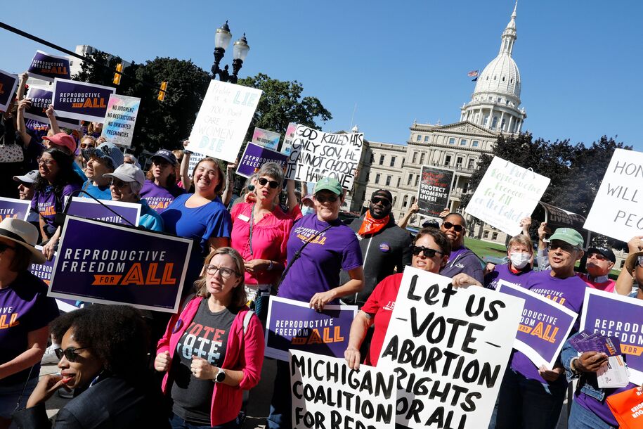 Pro choice supporters gather outside the Michigan State Capitol during a 'Restore Roe' rally in Lansing, on September 7, 2022. - Michigan's elections board last Wednesday rejected a voter initiative due to formatting of the petition text for the November ballot that would enshrine abortion rights in the state constitution, a move that sets the stage for a legal showdown at the state Supreme Court. More than 730,000 residents in Michigan signed a petition to get an amendment to enshrine reproductive rights into the Michigan's State Constitution. (Photo by JEFF KOWALSKY / AFP) (Photo by JEFF KOWALSKY/AFP via Getty Images)