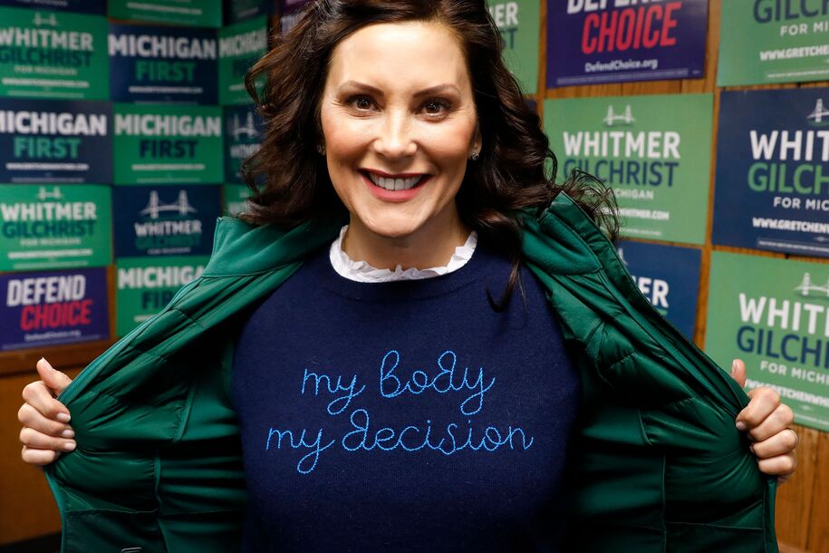 Michigan State Governor Gretchen Whitmer shows a 'My Body My Decision' shirt at the 14th District Democratic Headquarters, during the US midterm election in Detroit, Michigan, on November 8, 2022. (Photo by JEFF KOWALSKY / AFP) (Photo by JEFF KOWALSKY/AFP via Getty Images)