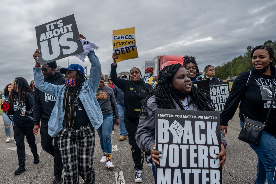 SELMA, ALABAMA - MARCH 09: Marchers chant during the Black Voters Matter's 57th Selma to Montgomery march on March 09, 2022 in Selma, Alabama. People gathered alongside organizations: Black Voters Matter, Rainbow PUSH Coalition, and the Transformative Justice Network to march the 11-mile original route that the late U.S. Rep. John Lewis and other civil rights leaders marched on March 7, 1965. In 1965, the march began at the Edmund Pettus Bridge and was met with brutal beatings of civil rights marchers at the hands of law enforcement. The march would later become known as 'Bloody Sunday'. The televised attacks were seen all over the nation, prompting public support for the civil rights activists in Selma and for the voting rights campaign. (Photo by Brandon Bell/Getty Images)