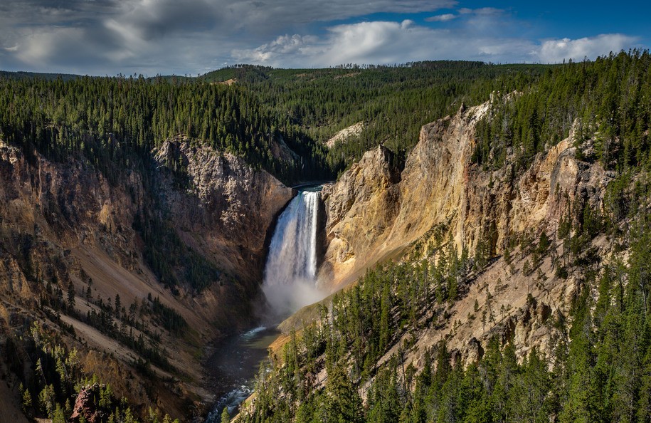 CANYON VILLAGE, WY - SEPTEMBER 21:  Upper Falls of the Yellowstone River is viewed flowing through The Grand Canyon of Yellowstone on September 21, 2022, near Canyon Village, Wyoming. Yellowstone National Park, America's first American National Park in northwestern Wyoming, spans an area of 3,468 square miles and has more hydrothermal features (geysers, steam vents, mud pots) than the rest of the world combined. (Photo by George Rose/Getty Images)