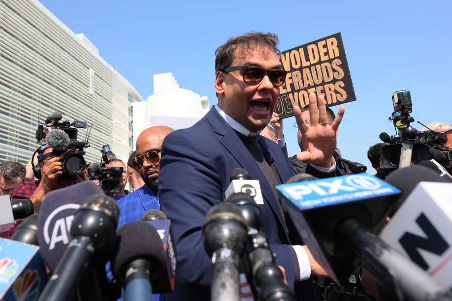 CENTRAL ISLIP, NEW YORK - MAY 10:  Rep. George Santos (R-NY) speaks with members of the press as he leaves Federal Court on May 10, 2023 in Central Islip, New York. Federal prosecutors in the Eastern District of New York have charged Santos in a 13-count indictment that includes seven counts of wire fraud, three counts of money laundering, one count of theft of public funds, and two counts of making materially false statements to the House of Representatives. The Republican congressman, who represents communities on Long Island and in Queens, has lied about his professional accomplishments, his education and his family's history, statements which surfaced after he was elected last year. He has admitted to embellishing his resume but denies any criminal wrongdoing. (Photo by Michael M. Santiago/Getty Images)