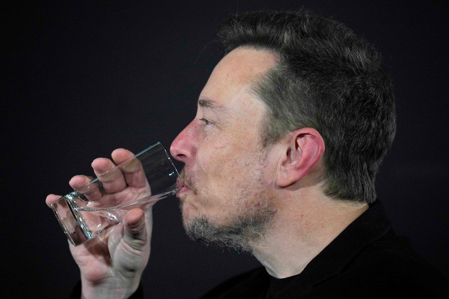 X (formerly Twitter) CEO Elon Musk drinks a glass of water during an in-conversation event with Britain's Prime Minister Rishi Sunak in London on November 2, 2023, following the UK Artificial Intelligence (AI) Safety Summit. (Photo by Kirsty Wigglesworth / POOL / AFP) (Photo by KIRSTY WIGGLESWORTH/POOL/AFP via Getty Images)