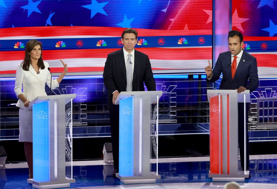 MIAMI, FLORIDA - NOVEMBER 08:  Republican presidential candidate former U.N. Ambassador Nikki Haley puts her hand up to Vivek Ramaswamy while he speaks to her as Florida Gov. Ron DeSantis (C) listens during the NBC News Republican Presidential Primary Debate at the Adrienne Arsht Center for the Performing Arts of Miami-Dade County on November 8, 2023 in Miami, Florida. Five presidential hopefuls squared off in the third Republican primary debate as former U.S. President Donald Trump, currently facing indictments in four locations, declined again to participate.  (Photo by Joe Raedle/Getty Images)