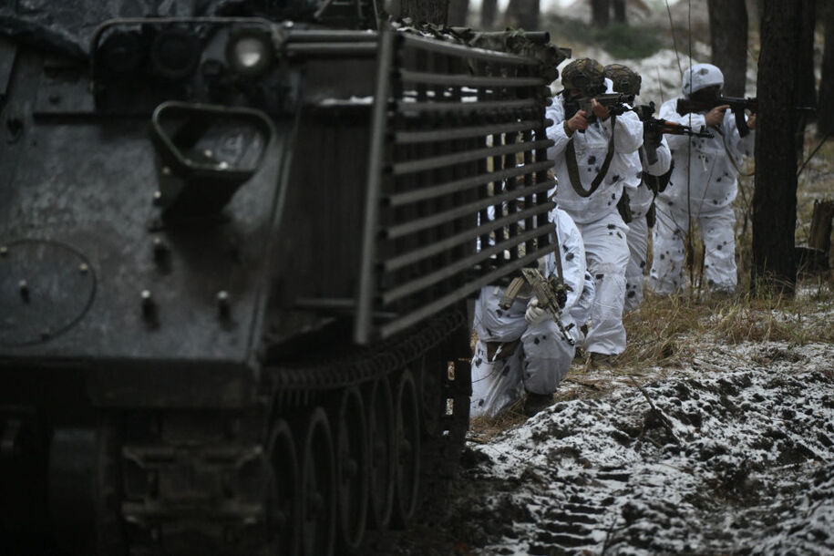 Ukrainian servicemen of the 43rd Mechanized Brigade in snow camouflage take part in a military training in an undisclosed location in the Kharkiv region on December 1, 2023, amid the Russian invasion of Ukraine. (Photo by Genya SAVILOV / AFP) (Photo by GENYA SAVILOV/AFP via Getty Images)