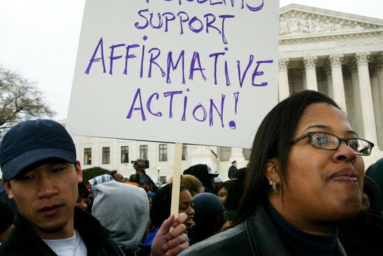 WASHINGTON - APRIL 1:  Ronya David (R) of Detroit, Michigan, and Henry Hwang (L), a Michigan University law student, attend a rally to defend the affirmative action outside the U.S. Supreme Court April 1, 2003 in Washington, DC.  The Supreme Court heard oral arguments in the University of Michigan affirmative action cases to see if the school can consider race in the undergraduate and law school admissions.  (Photo by Alex Wong/Getty Images)