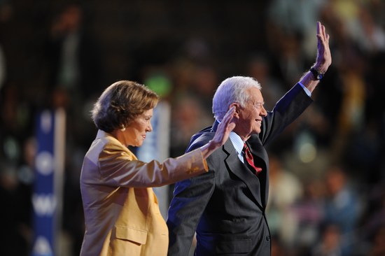 Former President Jimmy Carter and wife Rosalynn wave to the crowd at the Democratic National Convention 2008 at the Pepsi Center in Denver, Colorado, on August 25, 2008. The Democrats formally opened their convention to crown Barack Obama as the first black presidential election nominee. The DNC is held 25-28 August. The DNC is held 25-28 August. AFP PHOTO Robyn BECK        (Photo credit should read ROBYN BECK/AFP/Getty Images)