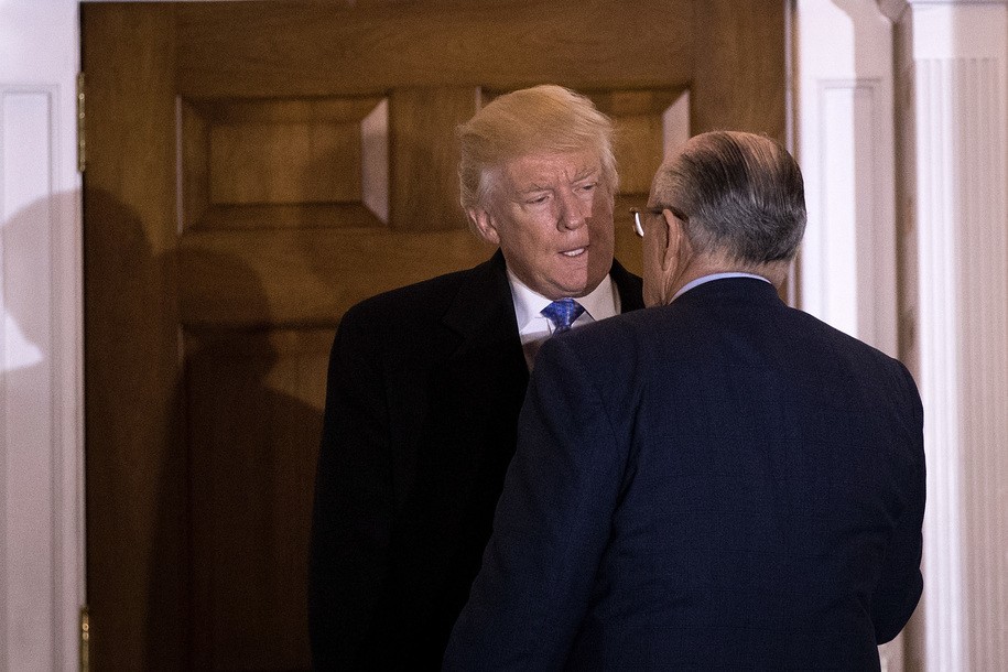 BEDMINSTER TOWNSHIP, NJ - NOVEMBER 20: (L to R) President-elect Donald Trump and former New York City mayor Rudy Giuliani talk to each other as they exit the clubhouse following their meeting at Trump International Golf Club, November 20, 2016 in Bedminster Township, New Jersey. Trump and his transition team are in the process of filling cabinet and other high level positions for the new administration. (Photo by Drew Angerer/Getty Images)