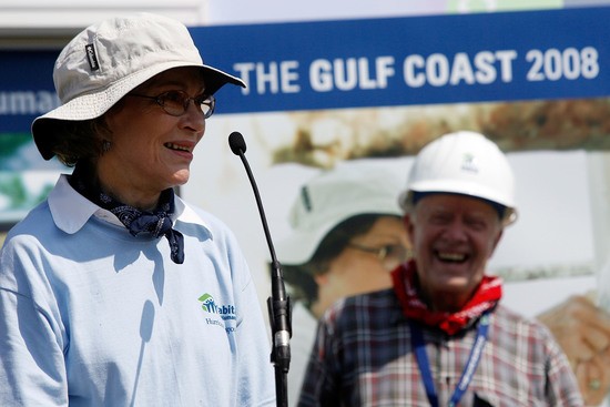 VIOLET, LA - MAY 21:  Rosalynn Carter (L) speaks as her husband, former U.S. President Jimmy Carter smiles after raising the wall on the 1,000th and 1,001st homes to be built by Habitat for Humanity on the Gulf Coast May 21, 2007 in Violet, Louisiana. Carter made waves May 19 when he said that the Bush administration "has been the worst in history", in an interview published in the Arkansas Democrat-Gazette. (Photo by Chris Graythen/Getty Images)