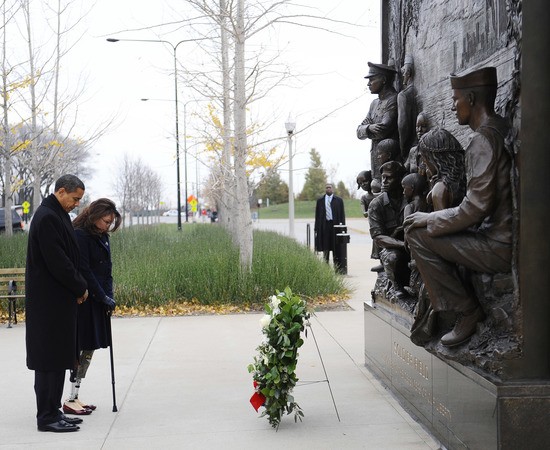 CHICAGO - NOVEMBER 11:  (AFP OUT) U.S. President-elect Barack Obama (L) and Gulf War veteran Tammy Duckworth both their heads after placing a wreath to honor America's veterans on Veterans Day at the Bronze Soldiers Memorial November 11, 2008 in Chicago, Illinois, The national holiday, held on the anniversary of the end of World War I, honors all those who have served their country in the military.  (Photo by Tannen Maury-Pool/Getty Images)