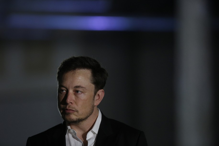 CHICAGO, IL - JUNE 14: Engineer and tech entrepreneur Elon Musk of The Boring Company listens as Chicago Mayor Rahm Emanuel talks about constructing a high speed transit tunnel at Block 37 during a news conference on June 14, 2018 in Chicago, Illinois. Musk said he could create a 16-passenger vehicle to operate on a high-speed rail system that could get travelers to and from downtown Chicago and O'hare International Airport under twenty minutes, at speeds of over 100 miles per hour. (Photo by Joshua Lott/Getty Images)