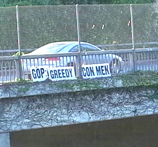 GOP: Greedy Con Men sign over Pasadena Freeway