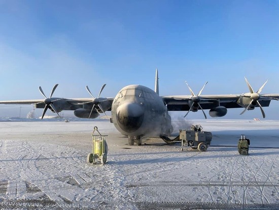 A WC-130 Hercules of the 53rd Weather Reconnaissance Squadron at Elemendorf AFB in Alaska in November 2023, waiting to be de-iced before heading out to drop ocean weather buoys.