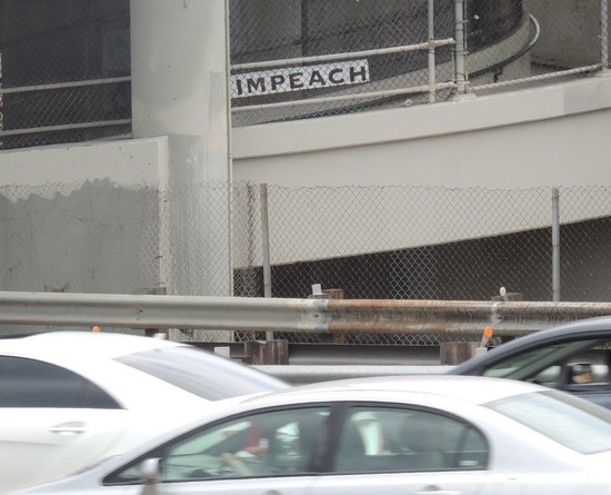 Impeach sign next to Hwy 110