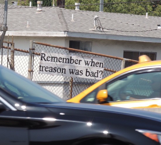 Remember when treason was bad? sign right next to Harbor fwy. downtown Los Angeles.