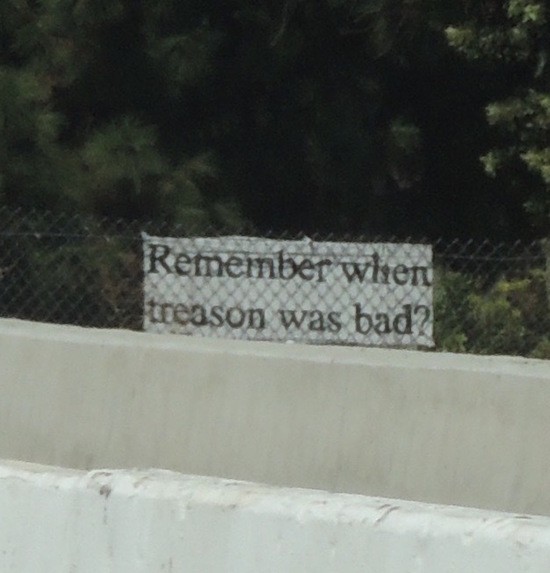 Remember when treason was bad? sign next to I-405