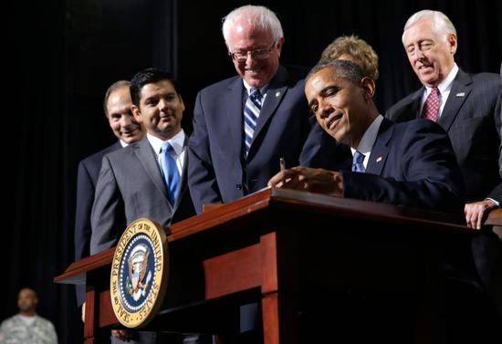 President Obama signs the 2014 Sanders-Miller VA Reform Bill.