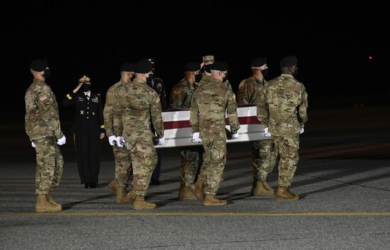 A U.S. Army carry team transfers the remains of Spc. Nick B. Regules of Largo, Florida, during a dignified transfer June 27, 2020, at Dover Air Force Base, Delaware. Regules was assigned to 2nd Battalion, 43rd Air Defense Artillery Regiment, 11th ADA Brigade, Fort Bliss, Texas. (U.S. Air Force Photo by Senior Airman Eric M. Fisher)